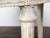 A pair of French Neoclassical style painted wood demilune console tables from the late 19th century, with carved rosettes,...