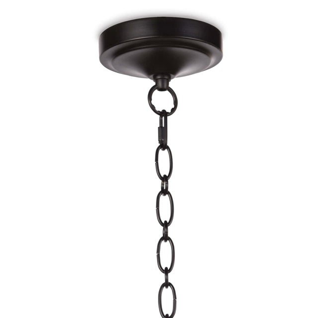 In full bloom: Cally’s fluted white ceramic shade is contrasted by an oil-rubbed bronze chain, which makes for a farmhouse...