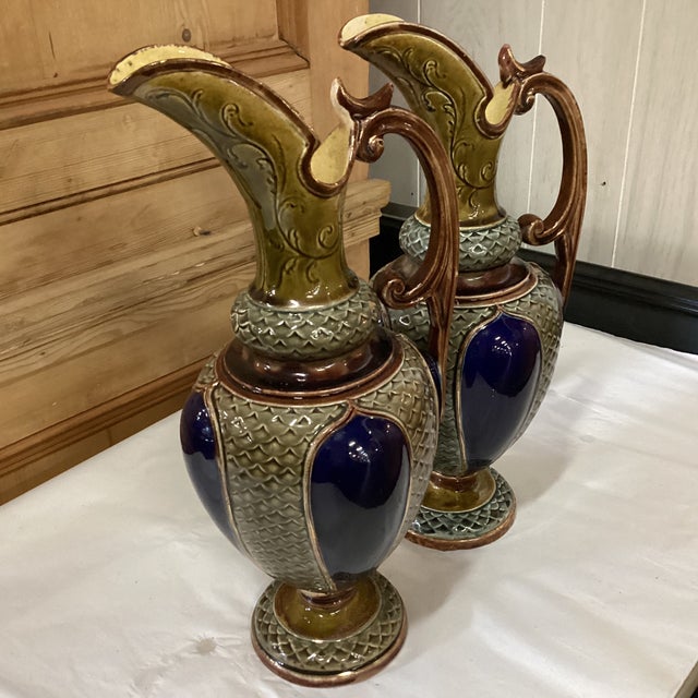 A pair of absolutely gorgeous and very collectible pair of pitchers from the late 19th to the turn of the 20th Century,...