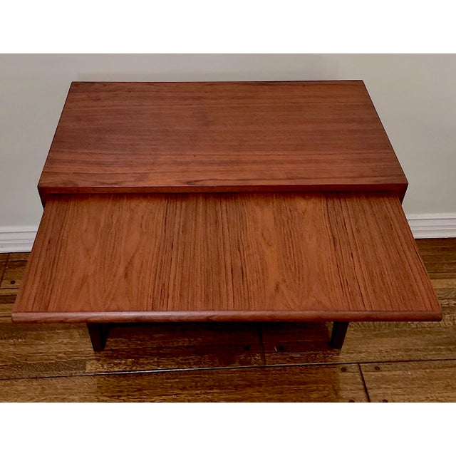 A compact midcentury teak credenza chest made in Sweden. The stylish cabinet was designed with a clever pull-out...