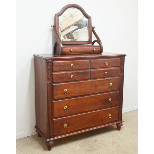 Chest and Mirror by Ethan Allen. Store item #568. Solid wood construction, carved details, beveled mirror. The mirror...