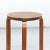 Stool designed by Alvar Aalto, circa 1960. Manufactured by Artek, (Finland) Leather top, wood legs and structure. In great...