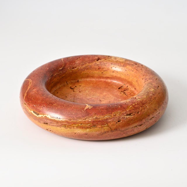 Italian-made red travertine bowl or catchall from the 1960s/1970s. This design is attributed to Pier Alessandro Giusti and...