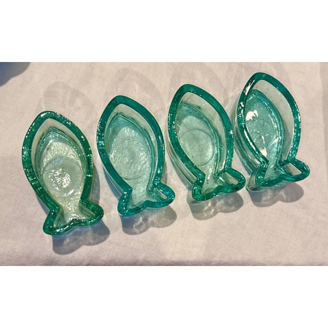 Four (4) hand blown glass trinket / votive / salt dishes. Perfect for adding a touch of contemporary elegance to your home...