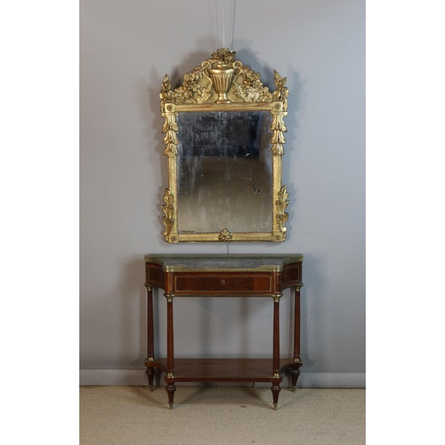 Giltwood mirror, Louis XV/Louis XVI Transition period. Mirror in its original condition. DIMENSIONS: 1.20m x 0.77m.