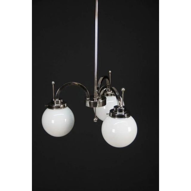 Nickel-plated 3-flaming art deco chandelier. 3 x 40w, e25-e27 bulbs nickel with minor age patina, polished rewired us...