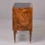 An elegant Italian chest of drawers veneered in richly figured burl walnut with spectacular swirling grain throughout,...