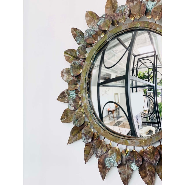 Individually hand-formed and painted copper leaves with 12” diameter convex mirror; overall diameter 23”. Available in...
