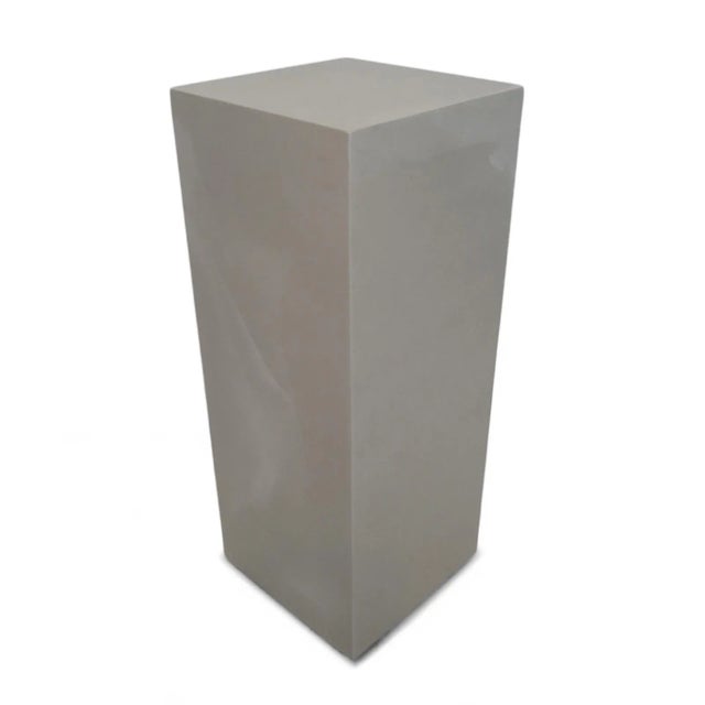 Modern cement resin pedestal stand with hollowed center. Great for outdoor or indoor use. Each may vary in exact natural...