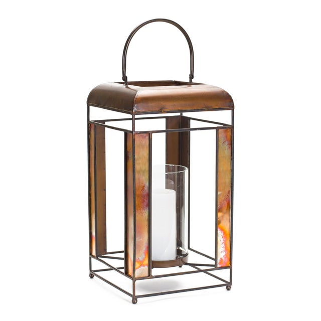 Elevate your home ambiance with this stunning Bronze Metal Lantern featuring elegant glass panels and a timeless hurricane...