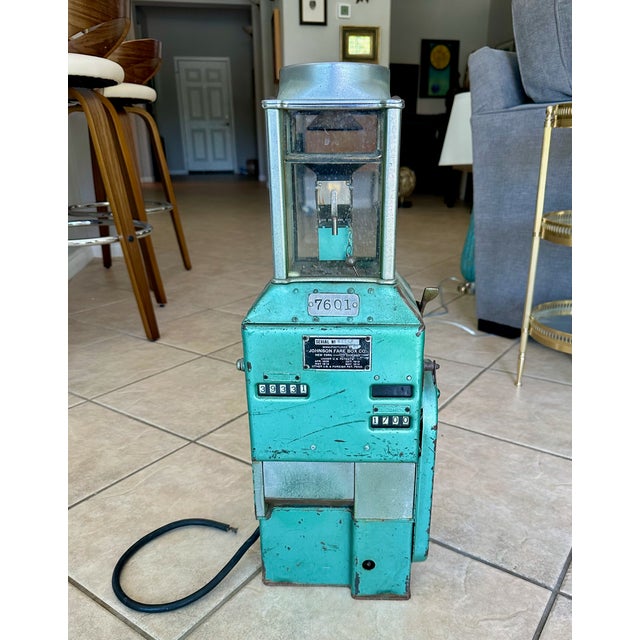 Antique 1900'S green Johnson Fare Box Co. trolley or bus fare box used to collect and count passenger fares.