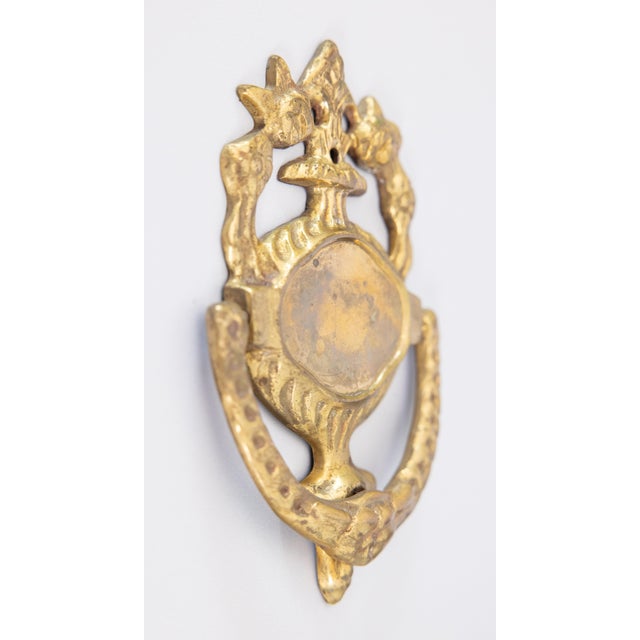 A superb antique early 20th-Century Art Nouveau French brass door knocker. This fine door knocker has an ornate design...