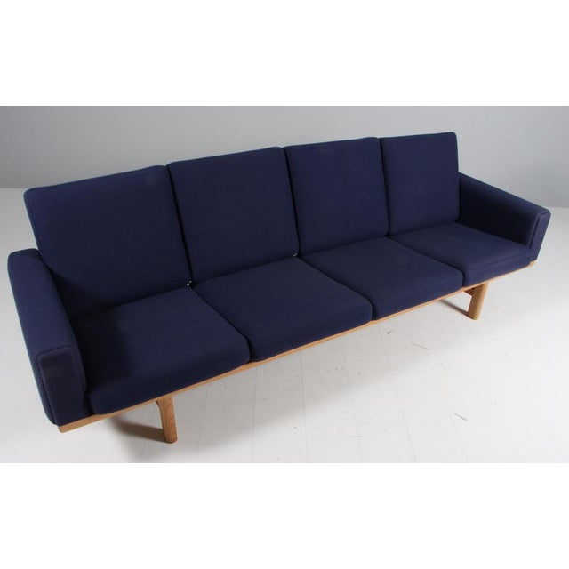 Hans J. Wegner four-seat sofa new upholstered with Halligdal wool from Kvadrat Frame in solid soap treated oak. Model...