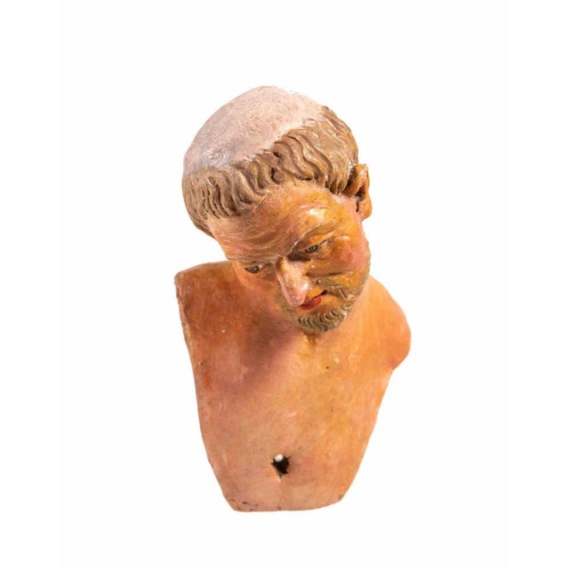 Head of man realized in polychrome ceramic with glass eyes. Neaples, 18th Century.