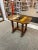 Vintage Catalina Style Accent Table with 6 Yellow and Black Colored Tiles. Turned Legs with stretcher. Makers Mark on the...