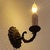 This set of four a vintage electric candlestick wall sconces. designed to mimic traditional candleholders. They feature a...