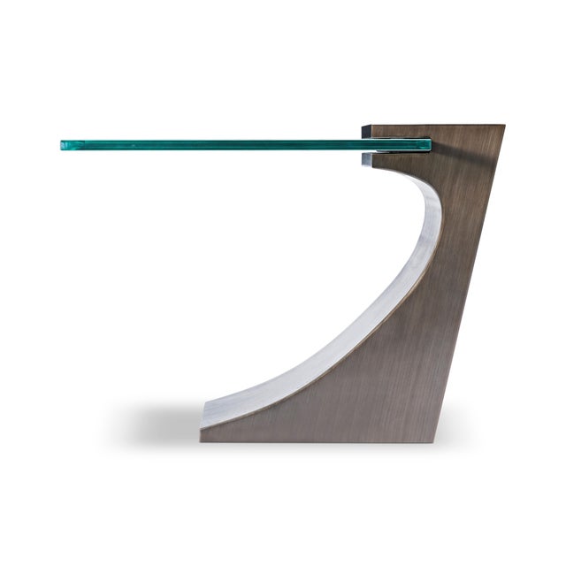 Modern Bronze lamp table designed by Greg Sheres. Cantilevered 3/4” glass top. This sculptural bronze table is one of...