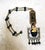 This stunning necklace is a true piece of history. The beautiful large pendant features intricate tribal symbols that are...