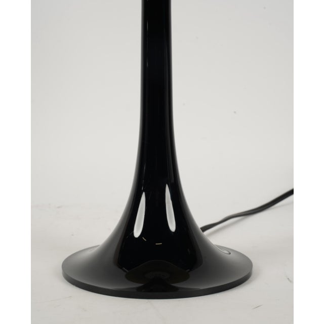 Description: Philippe Starck for Flos: Miss K Table Lamp black polycarbonate Dimensions: 17 x 9 1/4 in. (43.2 x 23.5 cm.)