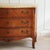 This three-drawer commode was crafted in the Louis XV style, likely dating from the 20th century. The curved, convex front...