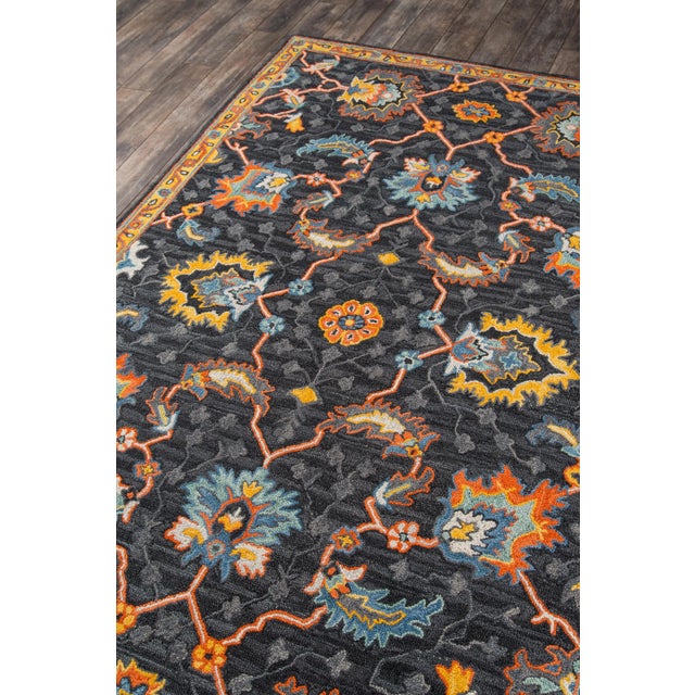The saturated shades of this decorative area rug reinvent the classic Persian carpet in a vivid color palette. The...