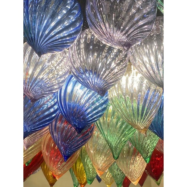 Scenographic Chandelier made with vintage drops hand-made in Murano glass. Lively vibrant colors of Murano glass in a new...