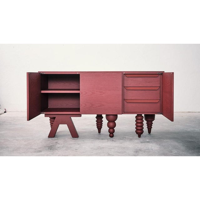2M Multileg Cabinet in Red Ash by Jaime Hayon for BD Barcelona It can be uniquely configured with twelve elaborate leg...