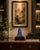 A stately Buddha sculpture, hand-carved from genuine natural lapis lazuli, distinguished by its magnificent deep blue...