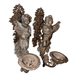 Antique Pair of Bronze Cherub Sconces For Sale