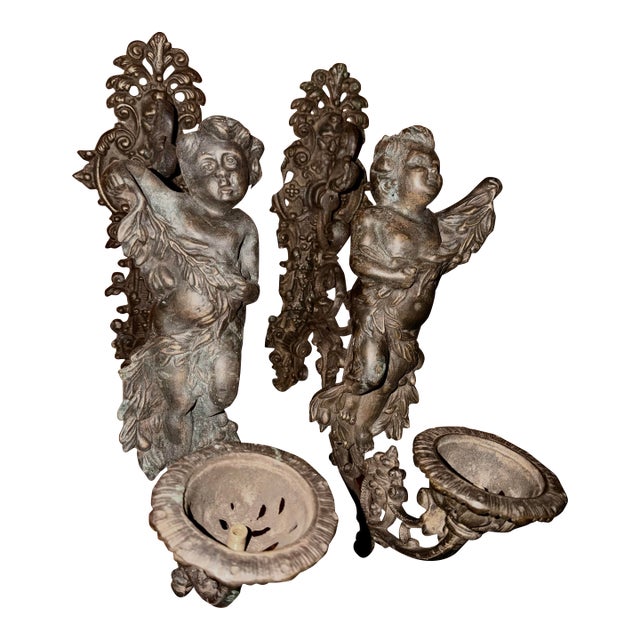 Antique Pair of Bronze Cherub Sconces For Sale