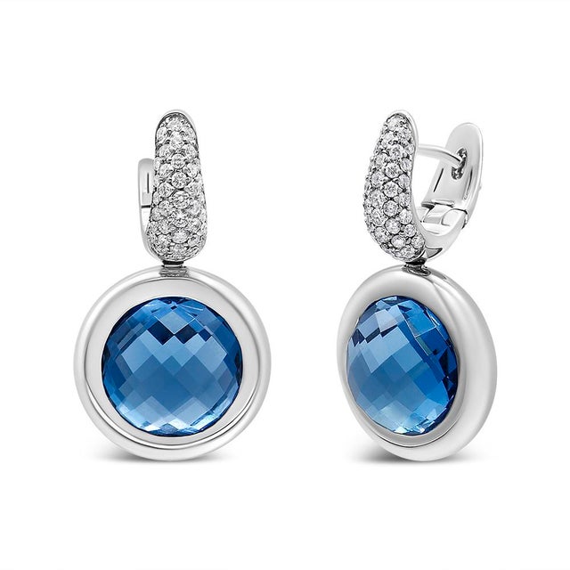 Infuse some blue hue to your attire with these gorgeous diamond and blue topaz drop earrings. Fashioned from luxurious 18K...