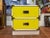 Yellow and White Campaign Colormates Nightstand attributed to Morris of California. Classic two drawer stand. Perfect for...