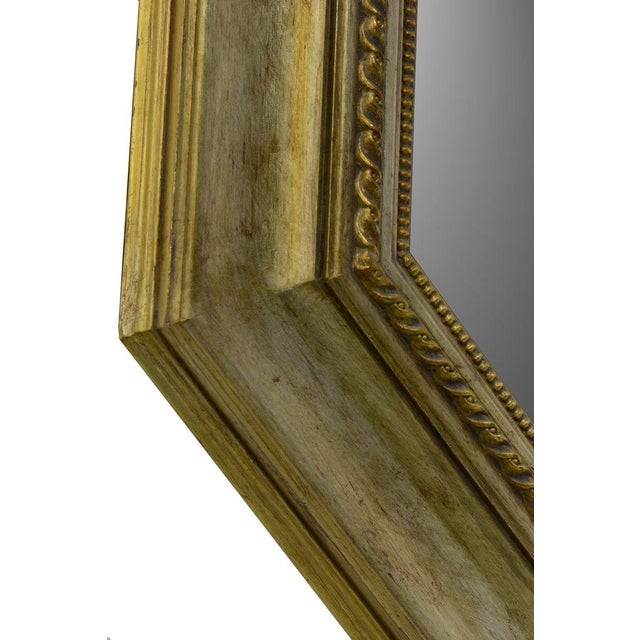 Dating from the 2000s, this Italian wall mirror is distinguished by its striking octagonal profile and richly finished...