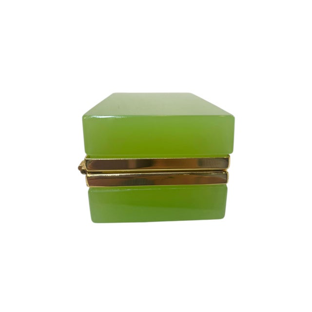 A beautiful French opaline glass box in a soft lime green tone with a gentle milky translucence that gives it a subtle...