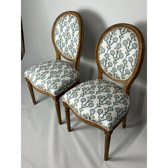Bring timeless elegance to your space with this pair of Louis XVI style chairs, beautifully reupholstered in 29 Park's...