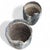 Pair of Vintage Patinated Industrial Crucible Planters. A pair of heavily textured vintage crucible vessels repurposed as...