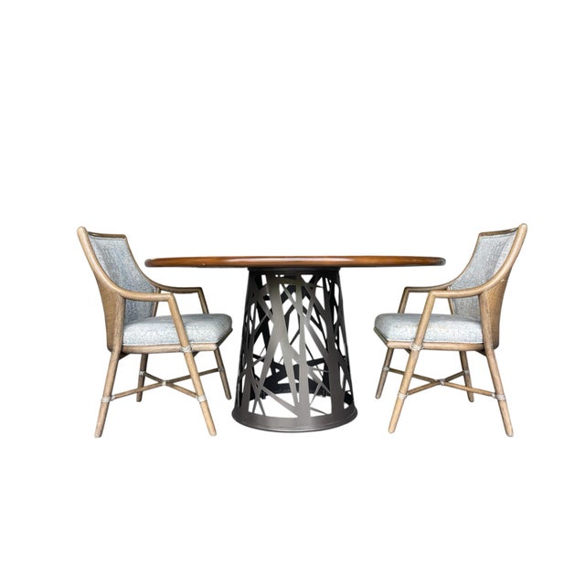 Attributed to Baker McGuire, this “Chaparral” round dining table features a sculptural cutout powder coated aluminum...