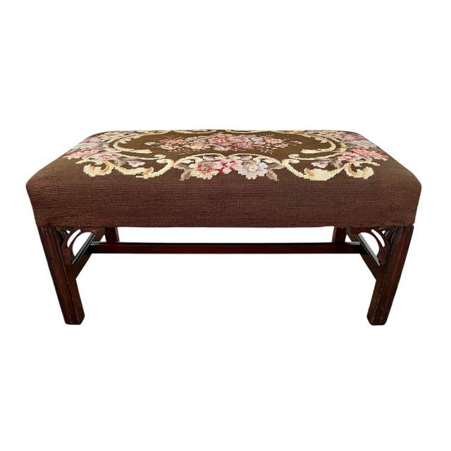 Antique Mahogany Footstool Upholstered in Needlepoint. Maker’s label at the underside of the stool (see photo). Filled...