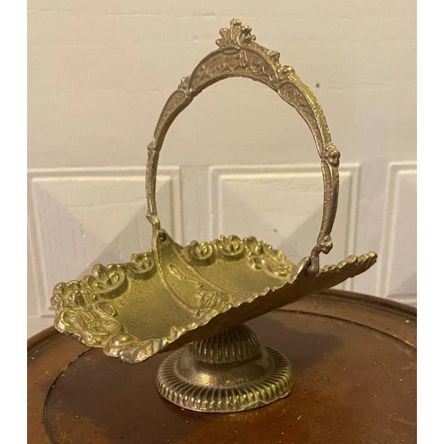 Beautiful antique gold brass serving dish. This ornate dish is footed, has a handle and a horse portrait in the dish....
