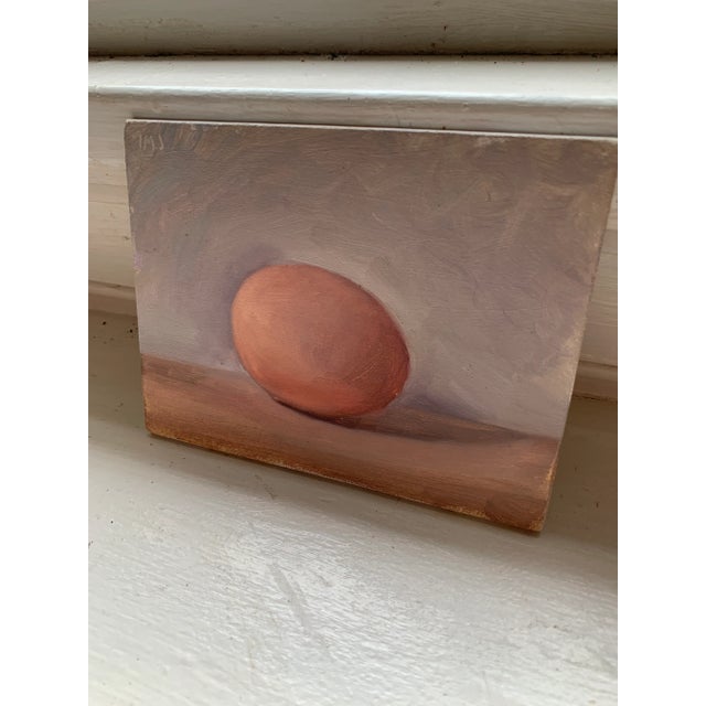 A quiet painting of a simple brown egg. Postcard from Provence A painting by Julian Merrow-Smith