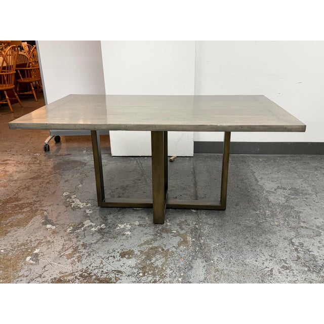 Design Plus Gallery presents a Bespoke Dining Table from Parish Co. The custom piece pairs a mitered plank top in Heritage...