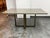 Design Plus Gallery presents a Bespoke Dining Table from Parish Co. The custom piece pairs a mitered plank top in Heritage...