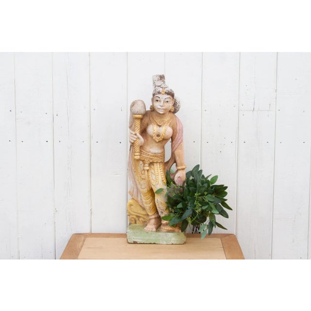 An antique finely carved statue from southern India that was originally part of an exterior wall of a temple. This antique...