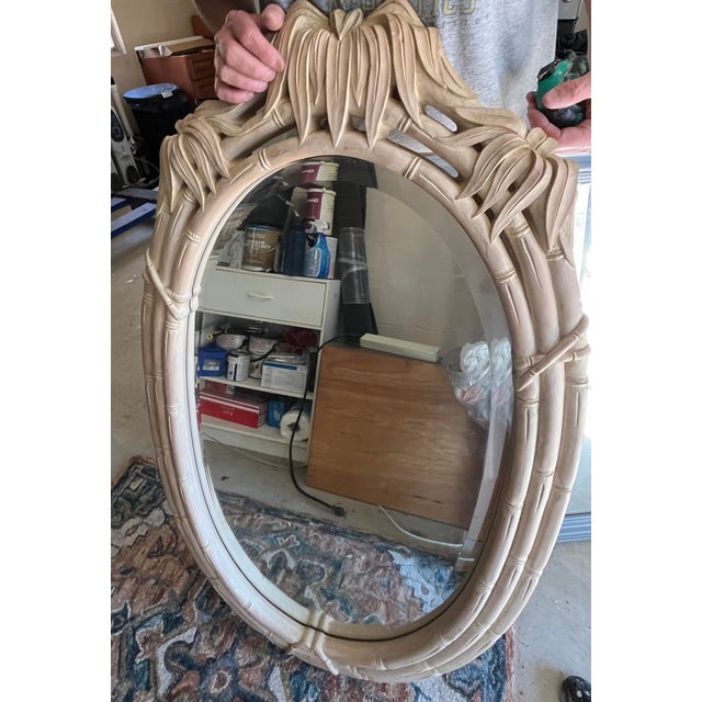 Beautiful vintage 1970s/1980s Hollywood Regency oval wall mirror. Features a heavy, durable molded resin/composite frame...