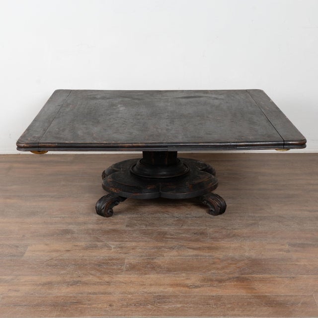 19th century black painted Swedish large square coffee table, crafted in oak. While the black paint is old, it is likely...