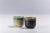 Incredible shades of rust and tobacco colors mark one of these two sake cups, combined with a second design distinguished...