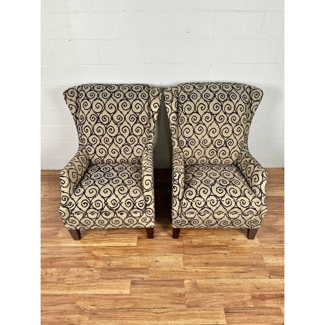 The Tempe Chair shows off more than a little personality thanks to swooping arms and slightly flared wings. It features a...