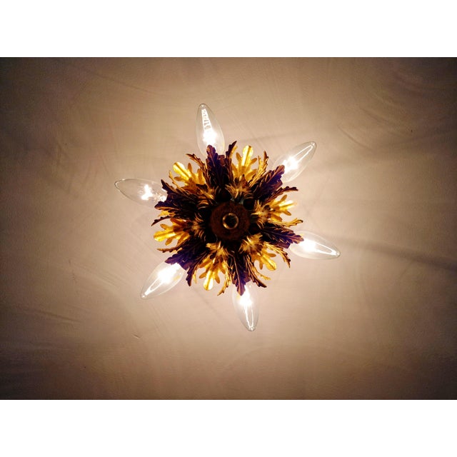 Gold-tone metal ceiling light with floral decoration, produced by the italian manufacturer banci firenze, 1970s....