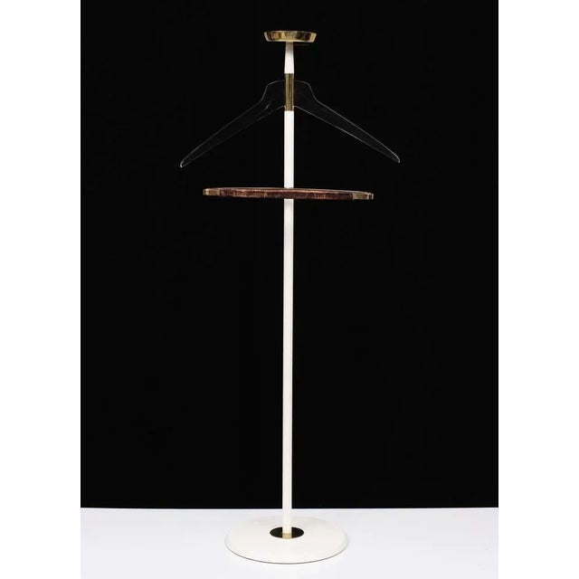 Very nice stylish valid stand, White upright and comes with Brass details. Lucite coat hanger. Made by Vereinigte...