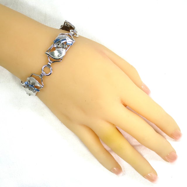 Vintage Art Deco designer Carl-Art sterling link bracelet 1930s. Each link is a curved frame with stylized leaves with a...